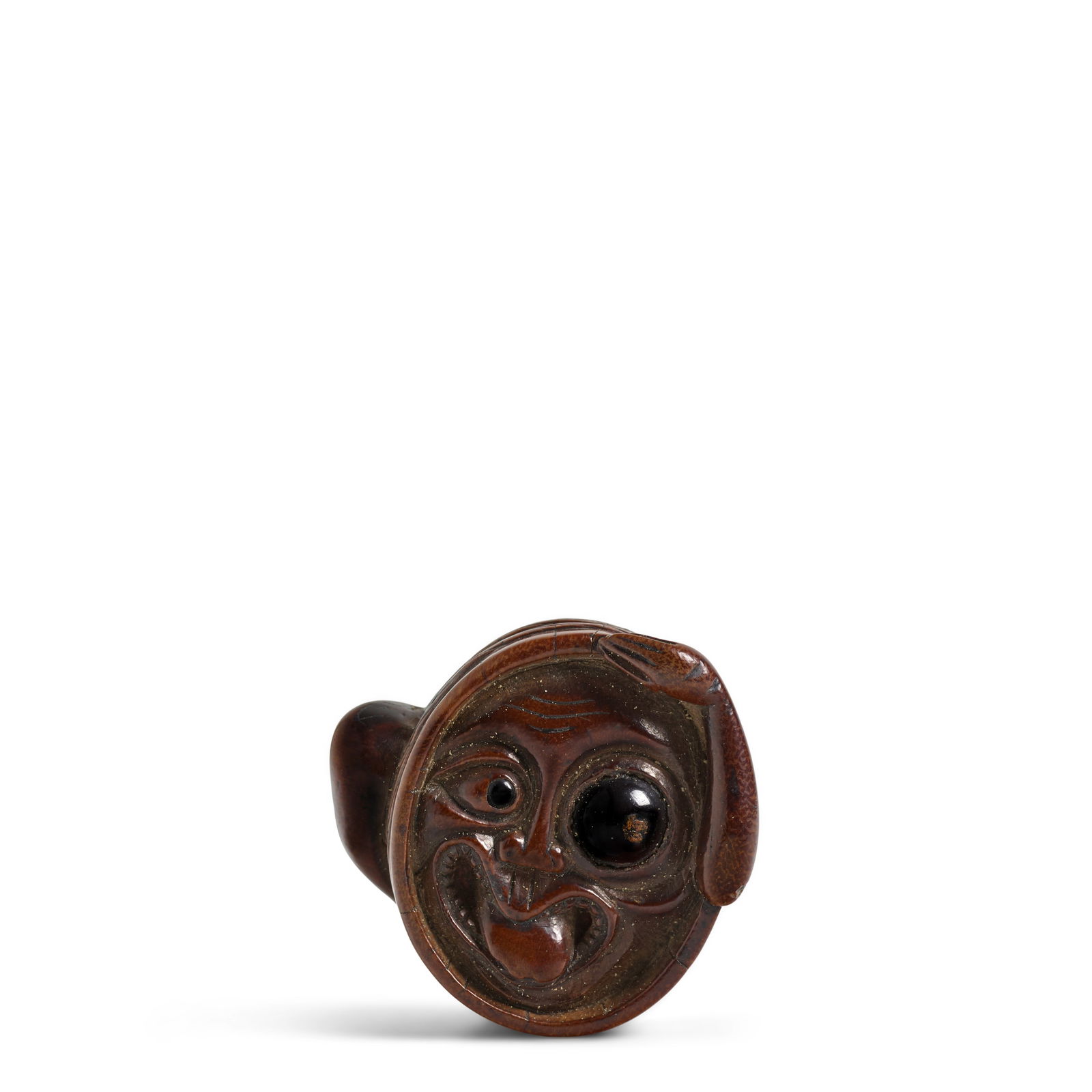 DEME UMAN (ACTIVE 18TH CENTURY) A Wood Netsuke of a Tsukomo-gami ('Possessed Spirit') Edo period...: DEME UMAN (ACTIVE 18TH CENTURY) A Wood Netsuke of a Tsukomo-gami ('Possessed Spirit') Edo period (1615-1868), 18th/19th century Carved as a grotesque figure emerging from a wood basin, one hand touchi