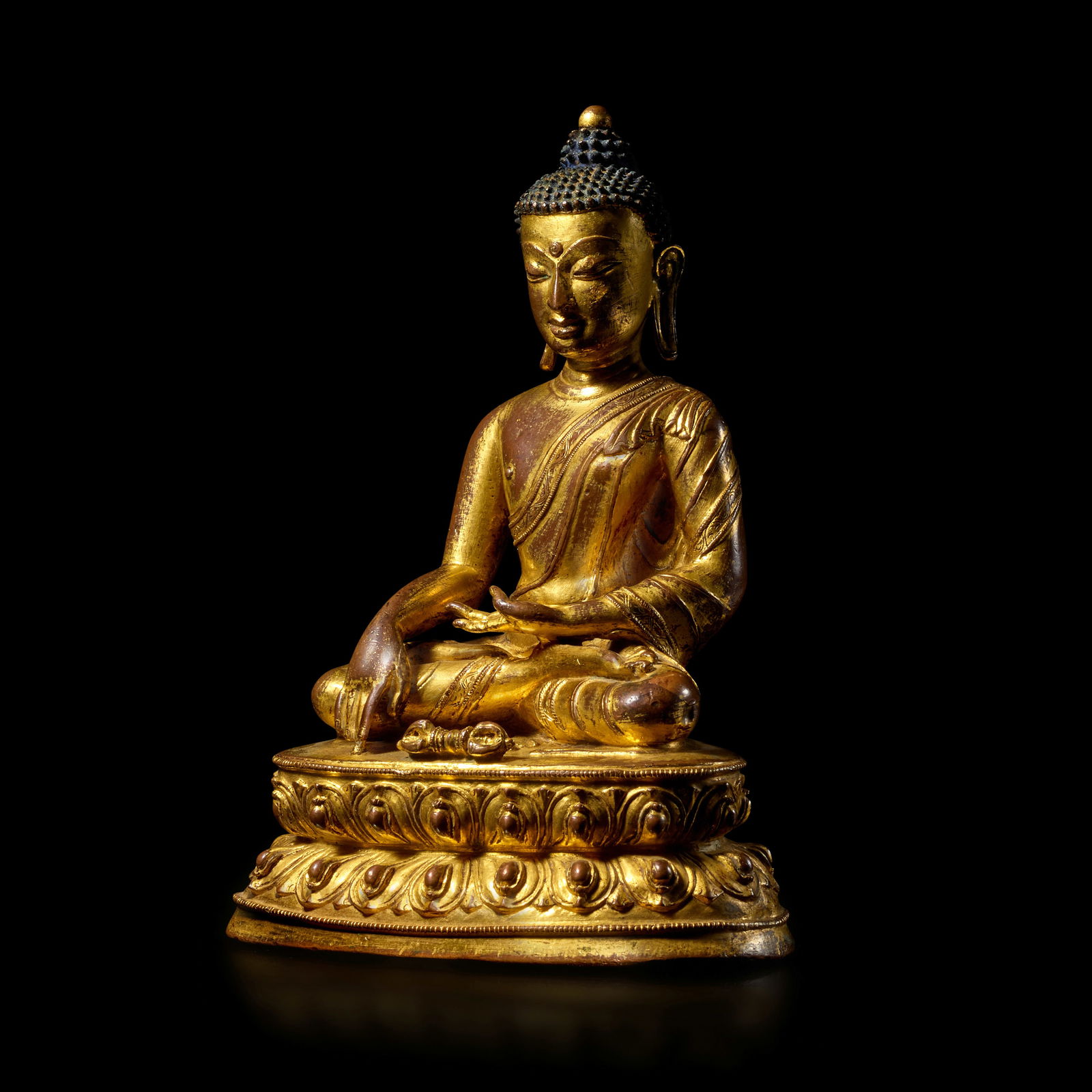 A GILT COPPER ALLOY FIGURE OF BUDDHA VAJRASANA TIBET, 15TH/16TH CENTURY: A GILT COPPER ALLOY FIGURE OF BUDDHA VAJRASANA TIBET, 15TH/16TH CENTURY Himalayan Art Resources item no. 8802 7 3/8 in. (18.8 cm) high Footnotes: 西藏 十五/十六