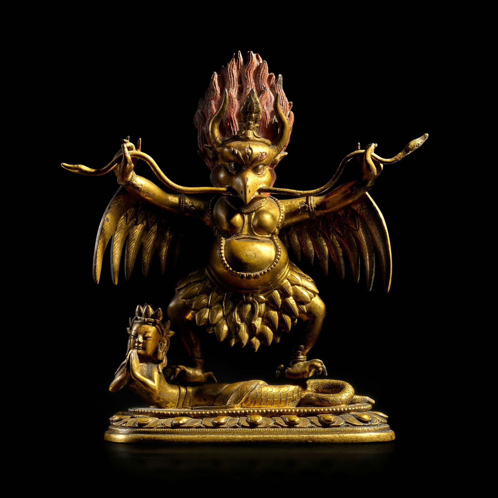 A GILT COPPER ALLOY FIGURE OF GARUDA QING DYNASTY, 18TH CENTURY: A GILT COPPER ALLOY FIGURE OF GARUDA QING DYNASTY, 18TH CENTURY An inscription on the back of the base, translated: 'Black Garuda'. Himalayan Art Resources item no. 2899 7 1/2 in. (18.7 cm) high Foot