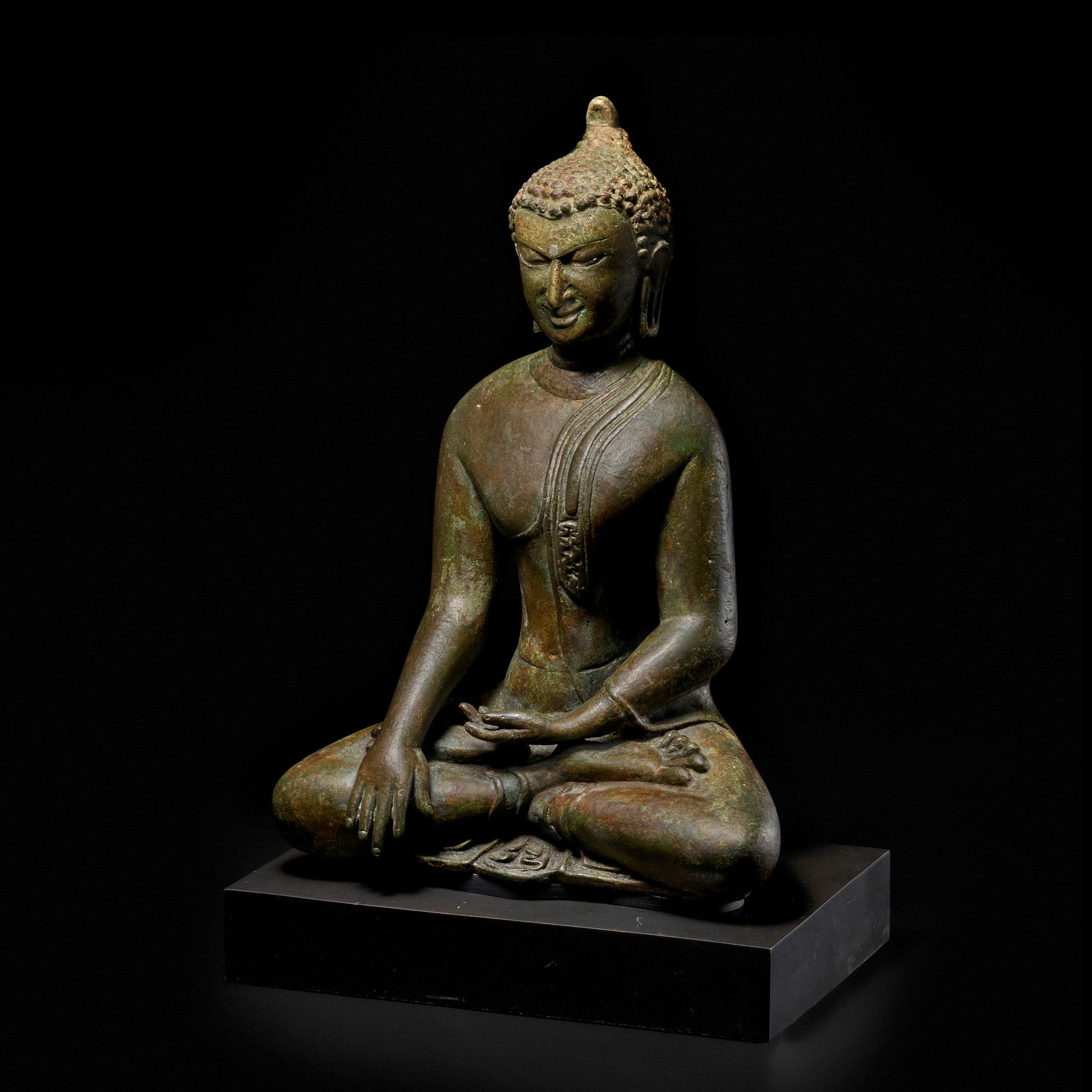 A SILVER INLAID COPPER ALLOY FIGURE OF BUDDHA MYANMAR (BURMA), PAGAN PERIOD, 12TH CENTURY: A SILVER INLAID COPPER ALLOY FIGURE OF BUDDHA MYANMAR (BURMA), PAGAN PERIOD, 12TH CENTURY 12 in. (30.5 cm) high Footnotes: 緬甸 蒲甘王朝 十二世
