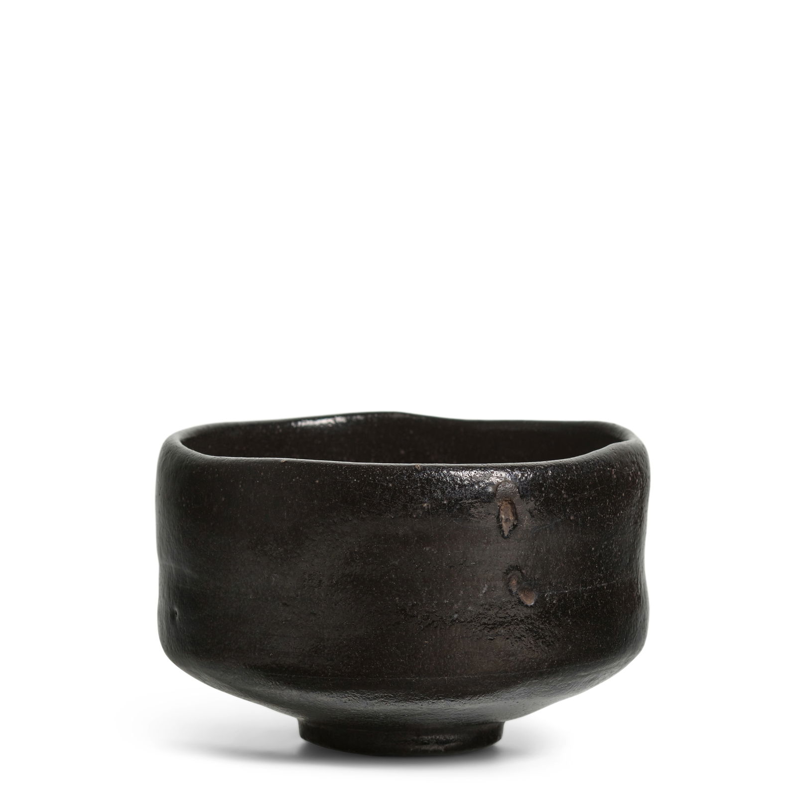 ATTRIBUTED TO RAKU SŌNYŪ (KICHIZAEMON V, 1664-1716) A Black Raku Ware Tea Bowl named K...: ATTRIBUTED TO RAKU SŌNYŪ (KICHIZAEMON V, 1664-1716) A Black Raku Ware Tea Bowl named Kuroki (Sacred Ebony) Edo period (1615-1868), early 18th century Chawan of typical Raku ware form, comple