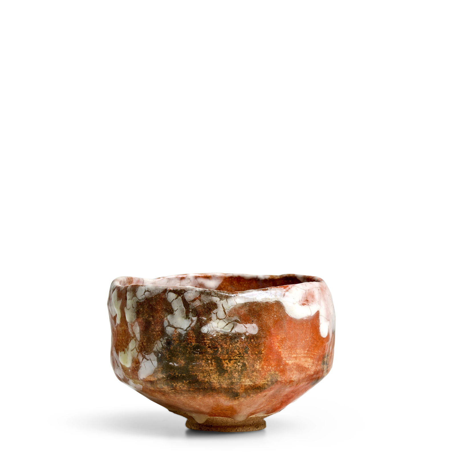 RAKU KŌNYŪ (KICHIZAEMON XII, 1857-1932) A Red Raku Ware Tea Bowl Meiji (1868-1912) or ...: RAKU KŌNYŪ (KICHIZAEMON XII, 1857-1932) A Red Raku Ware Tea Bowl Meiji (1868-1912) or Taisho era (1912-1926), before 1919 Chawan of typical Raku ware form, covered with red, black, white, an