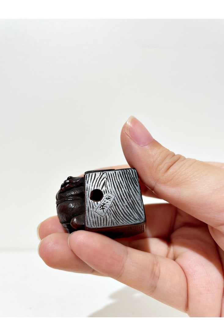 A WOOD NETSUKE OF DEMON WITH HIS HEAD IN A BOX Signed Tadayoshi [正美], Edo period - 2