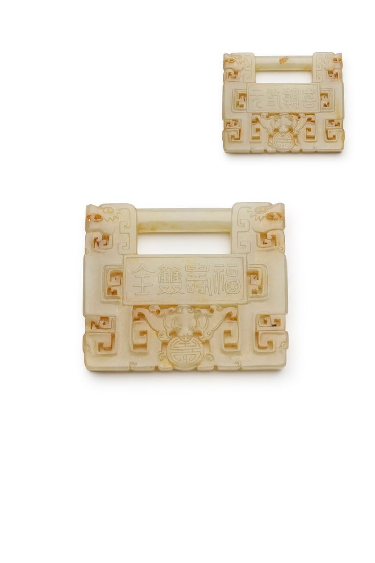 A CELADON JADE 'BAT AND COIN' LONGEVITY LOCK Late Qing to Republic period - 2