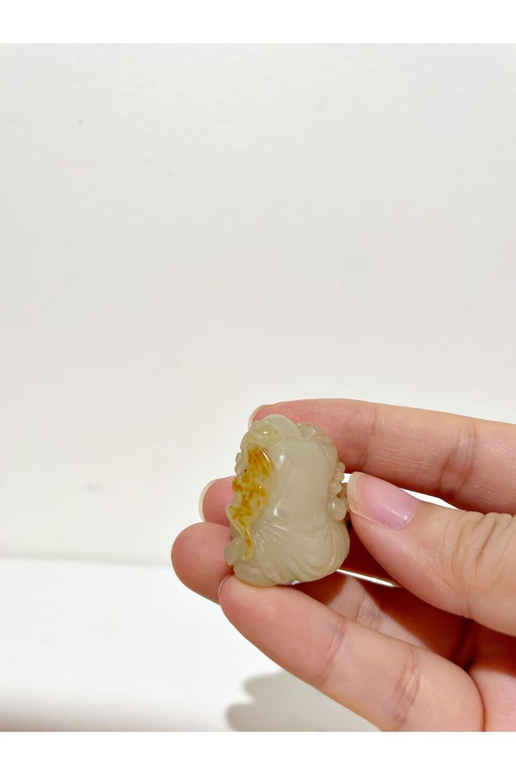 A WHITE JADE TOGGLE OF THE GOD OF LONGEVITY WITH RUSSET INCLUSIONS 20th century - 2