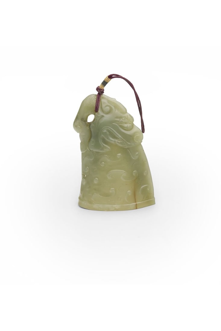 A GREEN JADE HORN-SHAPED PENDANT 20th century: A GREEN JADE HORN-SHAPED PENDANT 20th century 7.5cm high, 73g Footnotes: 二十世紀 青玉角形墜 For further information on this lot please visit Bonh