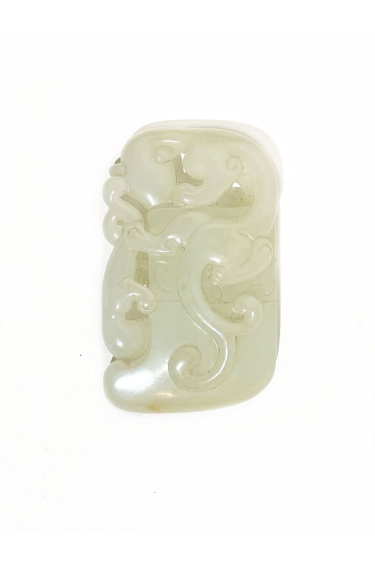 A WHITE JADE 'CHI-DRAGON' AX 19th century: A WHITE JADE 'CHI-DRAGON' AX 19th century 7.6cm long, 72g Footnotes: 清十九世紀 白玉螭龍紋斧 For further information on this lot