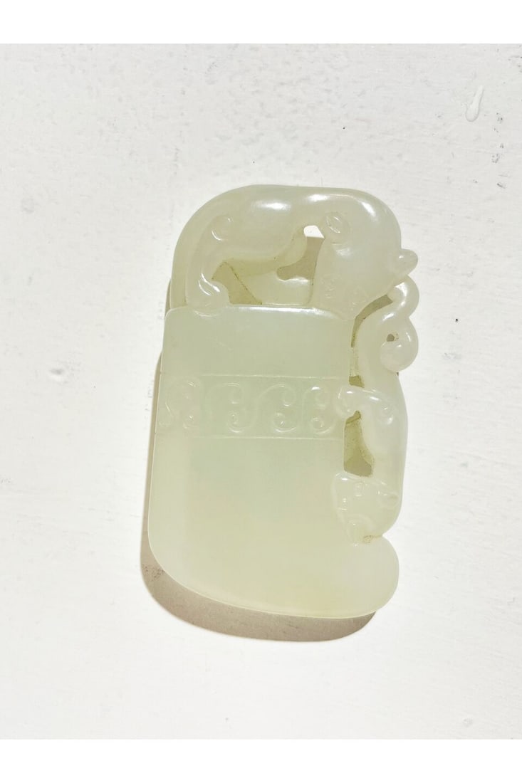 A WHITE JADE 'CHI-DRAGON' AX 19th century - 2