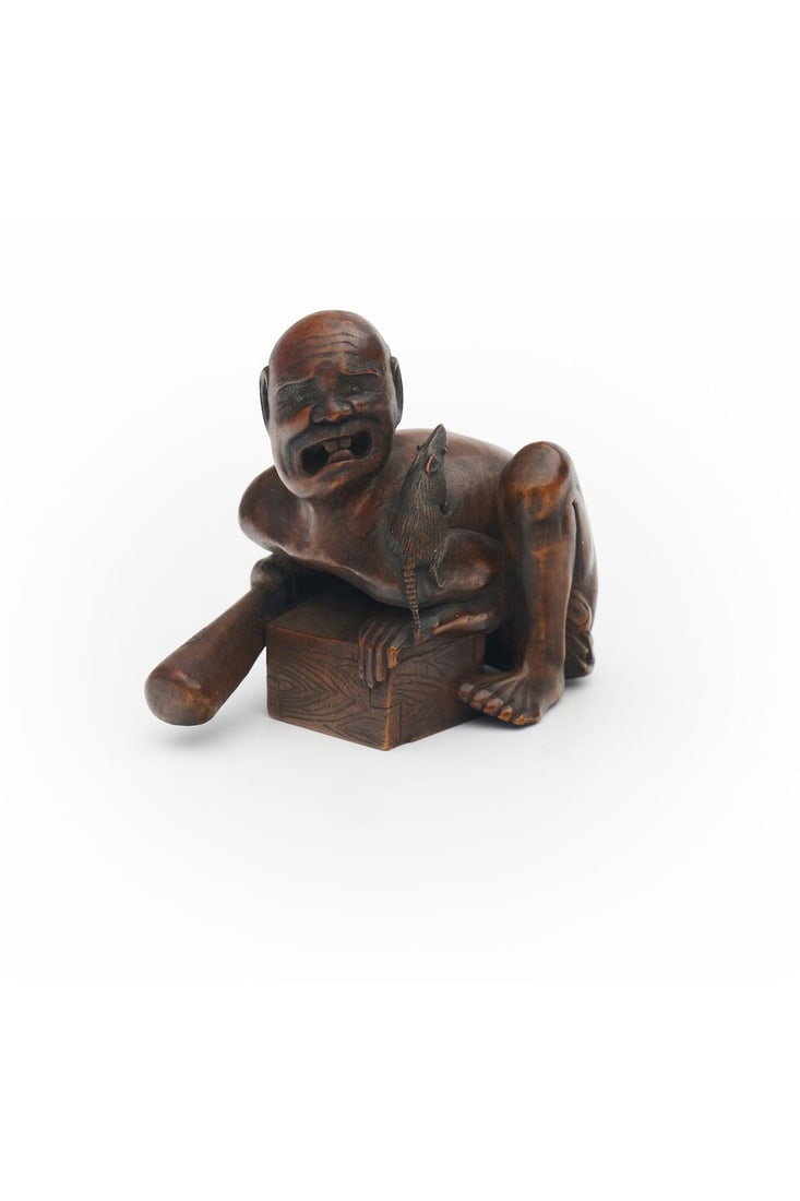 A WOOD NETSUKE OF A DISAPPOINTED RAT CATCHER Signed Sadayasu [貞康], 19th century: A WOOD NETSUKE OF A DISAPPOINTED RAT CATCHER Signed Sadayasu [貞康], 19th century 5.5cm high For further information on this lot please visit Bonhams.com For further information about
