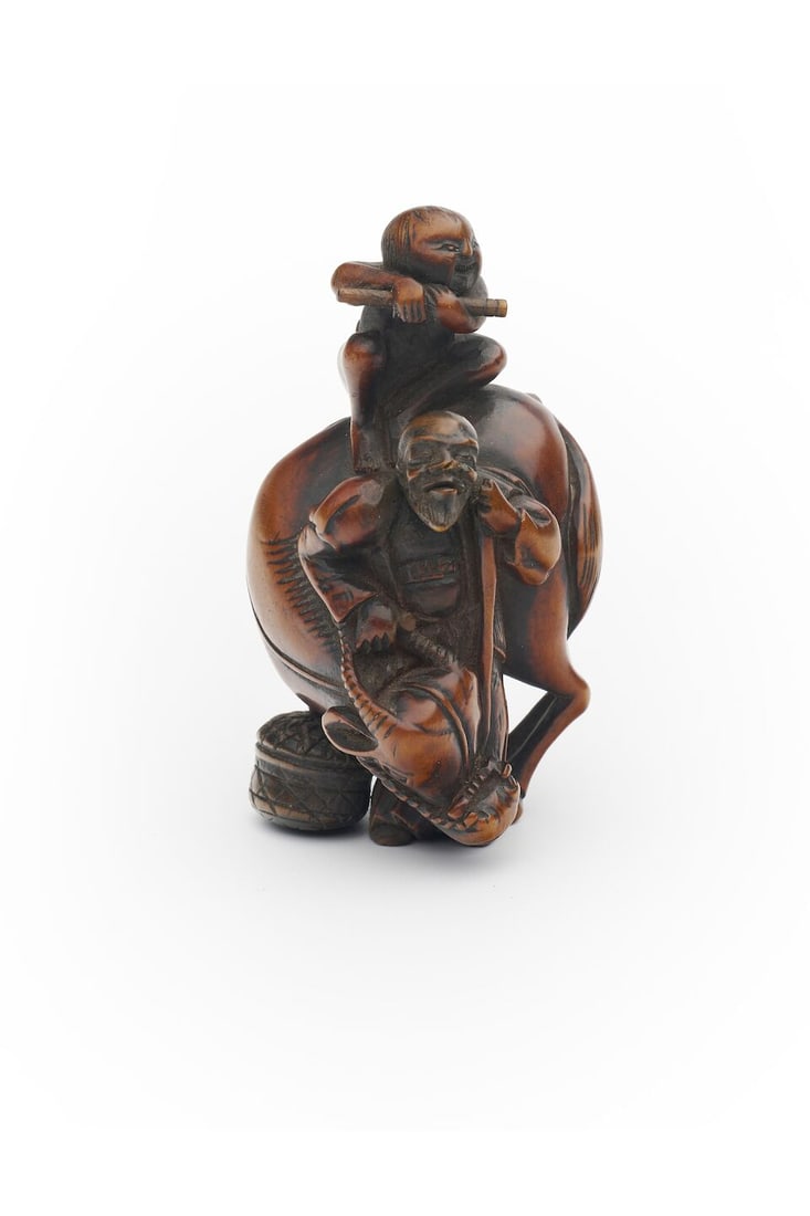 A BOXWOOD NETSUKE OF A MAN AND AN OX Signed Nagamitsu [長光], Edo period: A BOXWOOD NETSUKE OF A MAN AND AN OX Signed Nagamitsu [長光], Edo period 6.9cm high For further information on this lot please visit Bonhams.com For further information about this lot