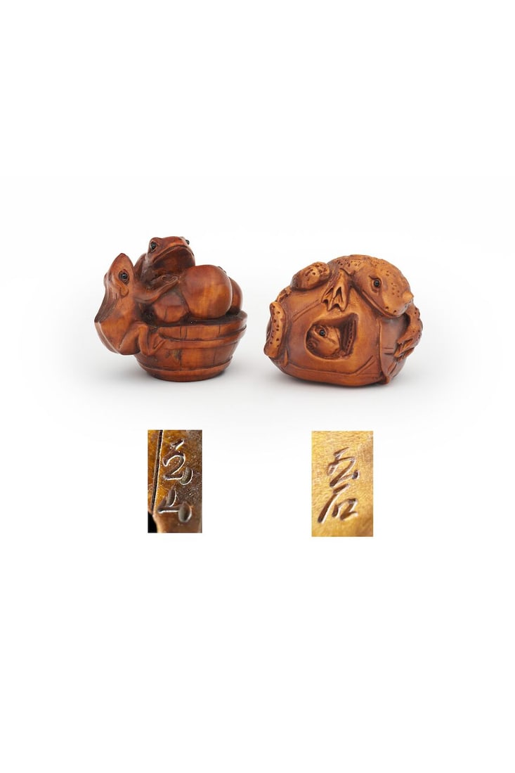 TWO WOOD NETSUKE OF TOADS AND FROGS Signed Tamayama [玉山] and Tamaishi [玉...: TWO WOOD NETSUKE OF TOADS AND FROGS Signed Tamayama [玉山] and Tamaishi [玉石], 19th/20th century 3.3cm and 3.6cm high (2). For further information on this lot please visit