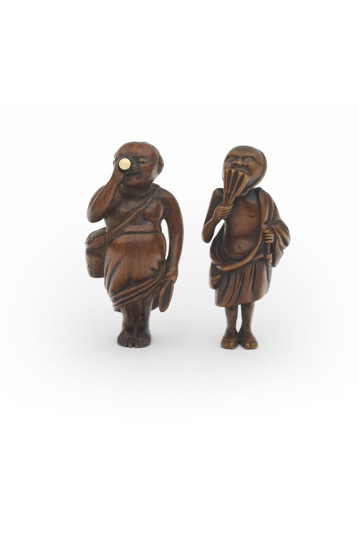TWO BOXWOOD NETSUKE OF A MAN EXAMINING AN EGG AND A DANCING YAMABUSHI 19th century (2): TWO BOXWOOD NETSUKE OF A MAN EXAMINING AN EGG AND A DANCING YAMABUSHI 19th century 5.8cm high each (2). For further information on this lot please visit Bonhams.com For further information about