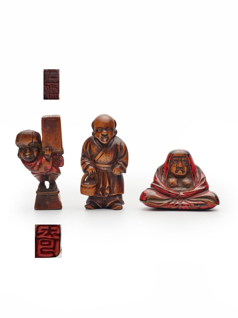 THREE WOODEN NETSUKE The 'monk' signed Ippyō [一瓢], 19th century (3): THREE WOODEN NETSUKE The 'monk' signed Ippyō [一瓢], 19th century comprising one seated Daruma, one nanbanjin with a basket in his right hand, and one monk carrying a box on his left