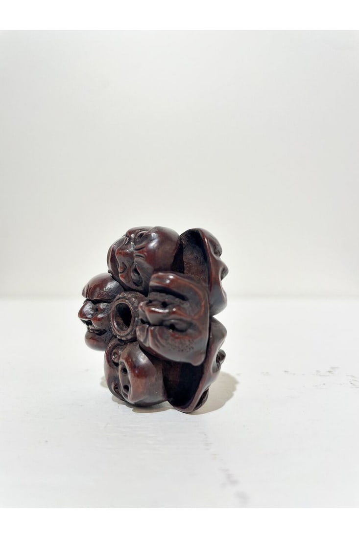 TWO WOOD NETSUKE OF NINE NOH AND KYŌGEN MASK AND TWO MASKS ON A BOX One signed (possibly) M... - 2