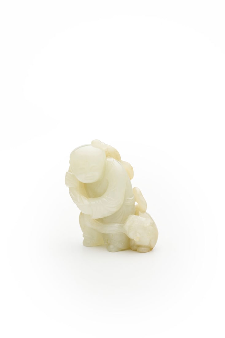 A CELADON JADE CARVING OF A CHILD AND LION PUP Qing Dynasty: A CELADON JADE CARVING OF A CHILD AND LION PUP Qing Dynasty 8.0cm high, 189g Footnotes: 清 青白玉童子小獅擺件 For further information on thi