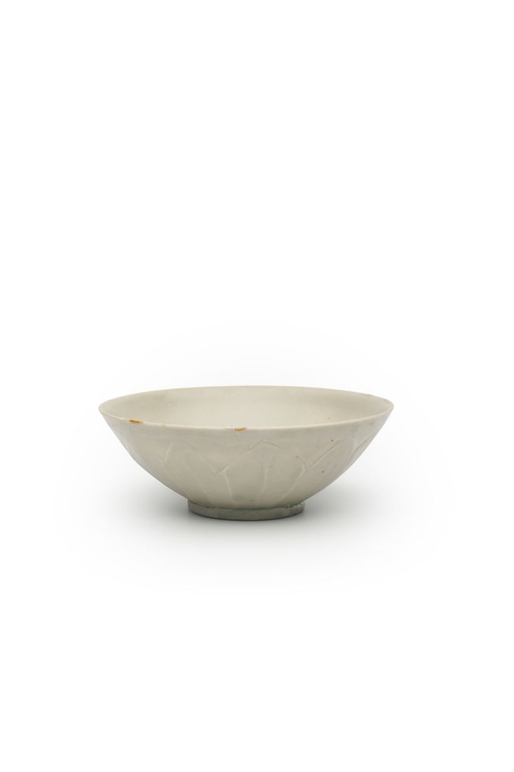 A QINGBAI 'LOTUS PETAL' BOWL 10th/11th century: A QINGBAI 'LOTUS PETAL' BOWL 10th/11th century 19.4cm diam. Footnotes: 十至十一世紀 青白蓮瓣紋碗 For further information on this