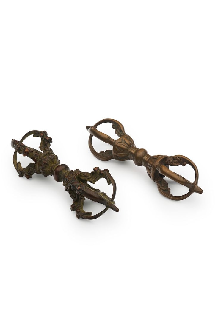 TWO COPPER ALLOY VAJRA Tibet (2): TWO COPPER ALLOY VAJRA Tibet 12.3cm, 12.0cm long (2). Footnotes: 西藏 金剛杵二件 For further information on this lot please visit Bonhams.com For further