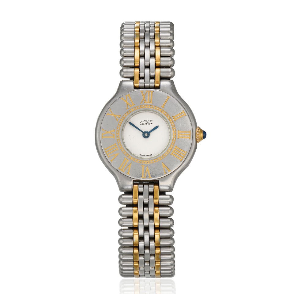 Cartier. A stainless steel and gold plated quartz bracelet watch Must de Cartier 21, Circa 1990: Cartier. A stainless steel and gold plated quartz bracelet watch Model: Must de Cartier 21 Date: Circa 1990 Movement: Jewelled Cal.890 quartz Dial: Cream Case: Brushed and polished round,