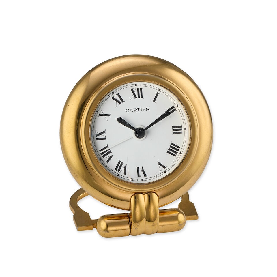 Cartier. A gilt brass quartz clock with alarm Colisée, Circa 1990 (1 of 1)