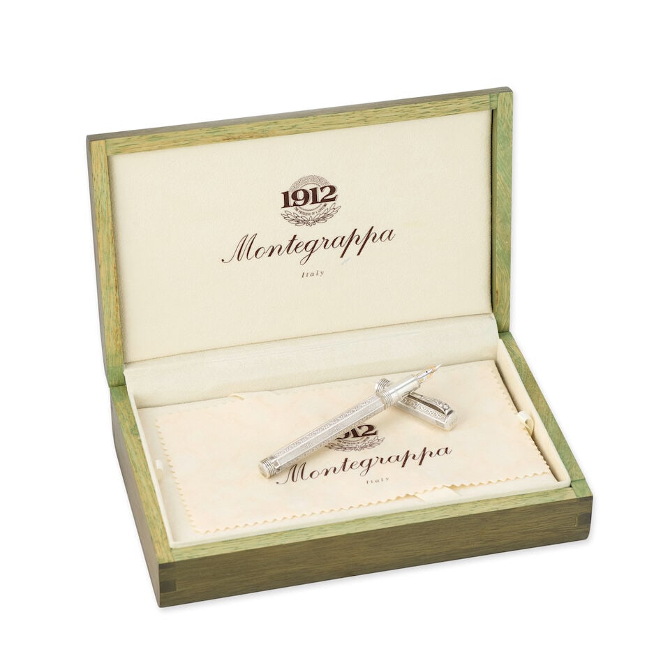 Montegrappa. A Limited Edition silver fountain pen Romeo and Juliet, one of 3500, Circa 1995: Montegrappa. A Limited Edition silver fountain pen Medium 18K two-tone gold nib Model: Romeo and Juliet, one of 3500 Date: Circa 1995 Case: No.543 Accompaniments: Montgrappa box, outer box,