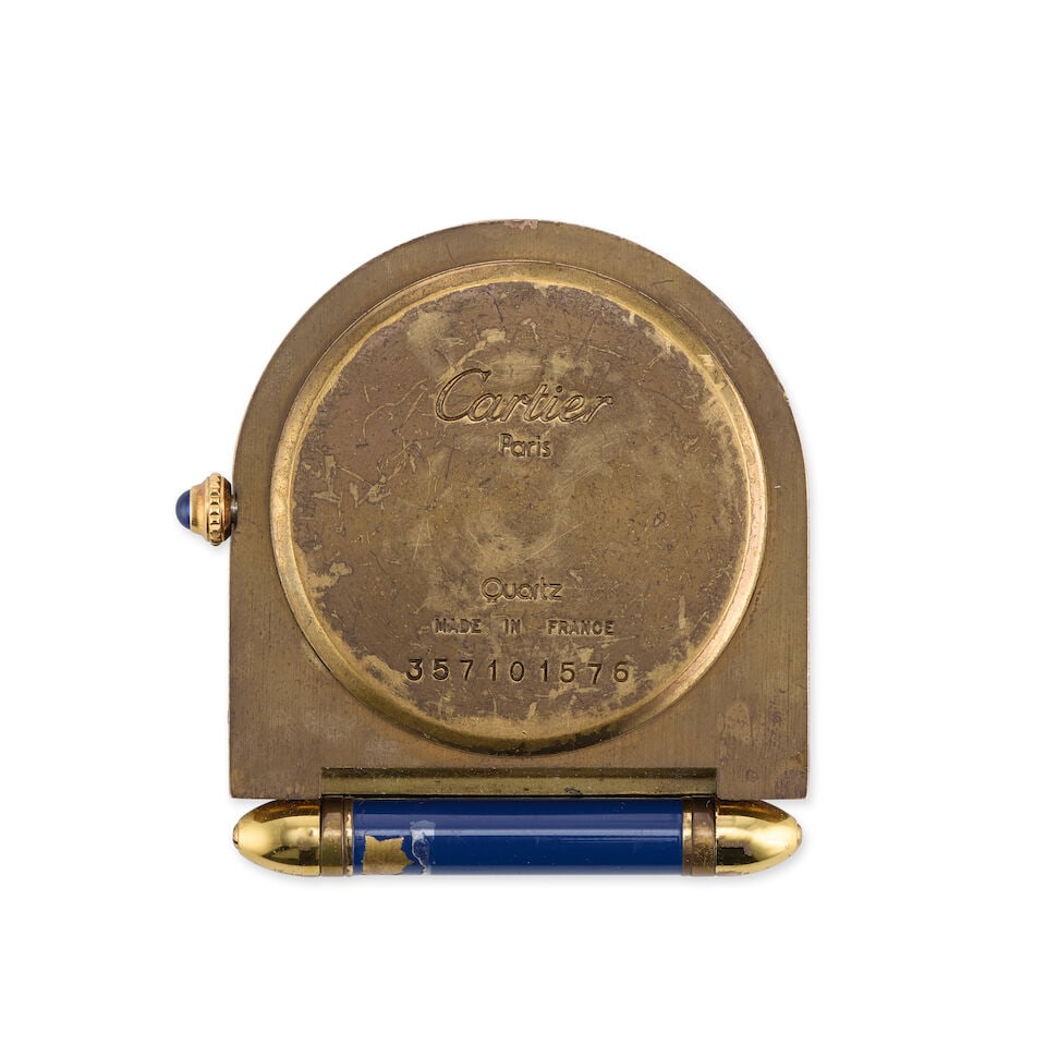Cartier. A gilt and enamel quartz travel clock with alarm Pendulette, Circa 1990 - 2
