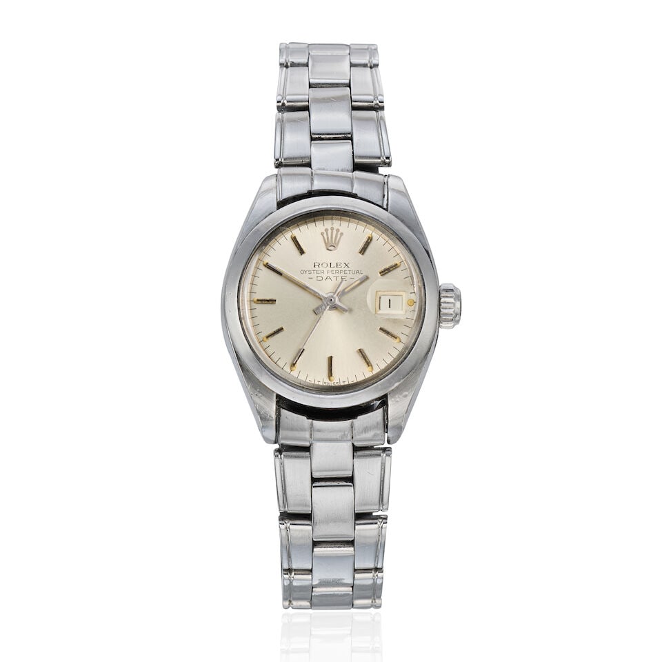 Rolex. A lady's stainless steel automatic calendar watch Date, Ref: 6916, Circa 1982: Rolex. A lady's stainless steel automatic calendar watch Model: Date Reference: 6916 Date: Circa 1982 Movement: 20-jewel Cal.2030 automatic, No.133029 Dial: Sunburst silvered Case: Brushed and