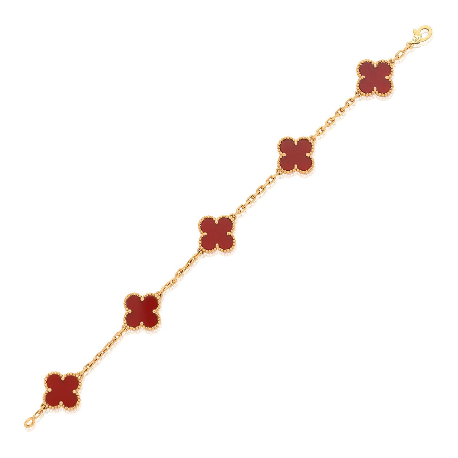 VAN CLEEF & ARPELS: CARNELIAN 'ALHAMBRA' BRACELET: VAN CLEEF & ARPELS: CARNELIAN 'ALHAMBRA' BRACELETQuatrefoil carnelian motifs, connected via faceted cable-linking, mounted in 18 carat gold, signed VCA, numbered JC292594, maker's mark, Swiss assay