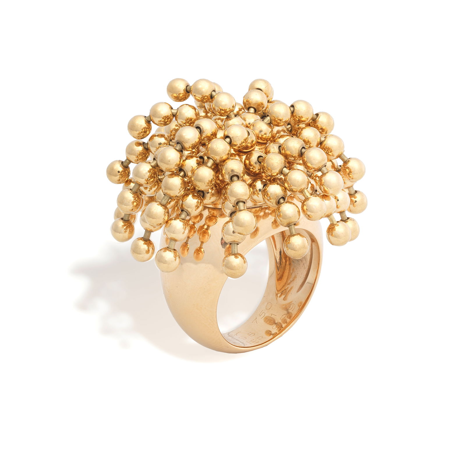 CARTIER: 'PERRUQUE' RING: CARTIER: 'PERRUQUE' RINGThe beaded tassels, on a tapering polished band, signed Cartier, numbered J52895, French assay mark, ring size approx. J½, maker's pouch