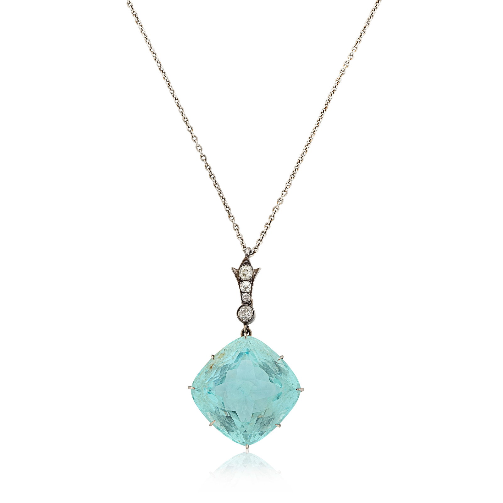 AQUAMARINE AND DIAMOND PENDANT/NECKLACE, CIRCA 1925: AQUAMARINE AND DIAMOND PENDANT/NECKLACE, CIRCA 1925 The cushion-shaped aquamarine beneath an old cushion-shaped diamond surmount, mounted in silver, suspended from a later trace link chain, lengths: p