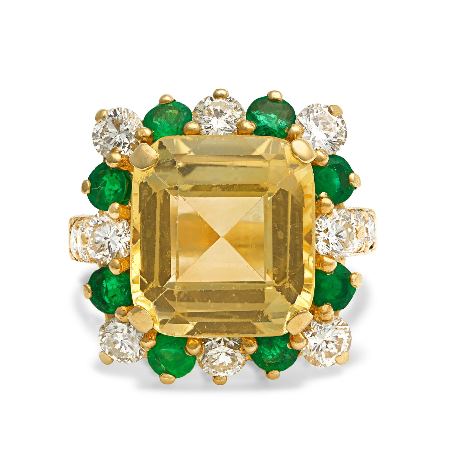 YELLOW SAPPHIRE, EMERALD AND DIAMOND RING: YELLOW SAPPHIRE, EMERALD AND DIAMOND RINGThe octagonal step-cut yellow sapphire weighing 8.55 carats, within a brilliant-cut diamond and circular-cut emerald surround, mount signed V.C.A, diamonds