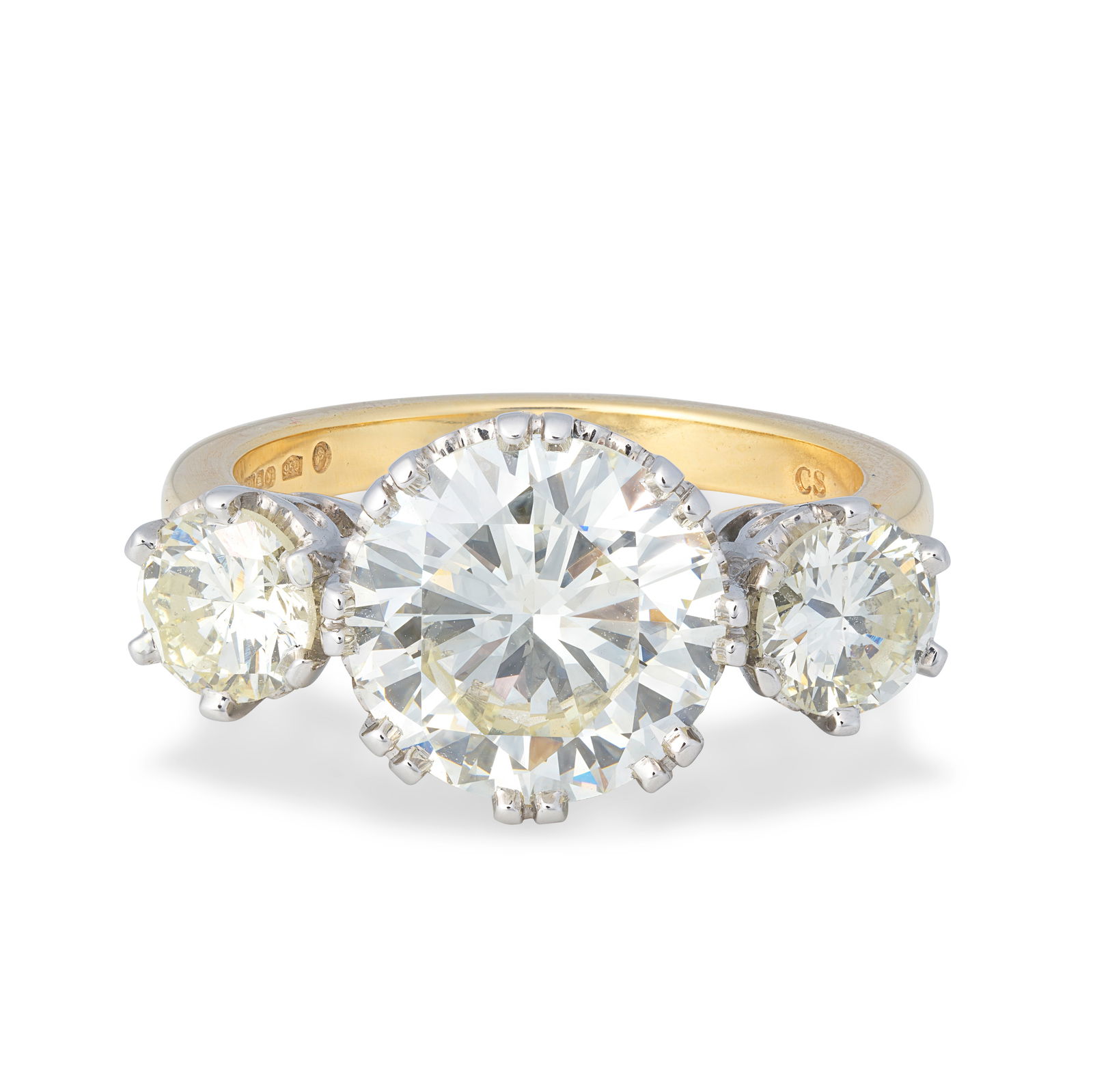 DIAMOND THREE-STONE RING, 2023: DIAMOND THREE-STONE RING, 2023Three brilliant-cut diamonds, weighing 0.78, 4.07 and 0.78 carats, mounted in platinum and 18 carat gold, London hallmark, ring size approx. P½