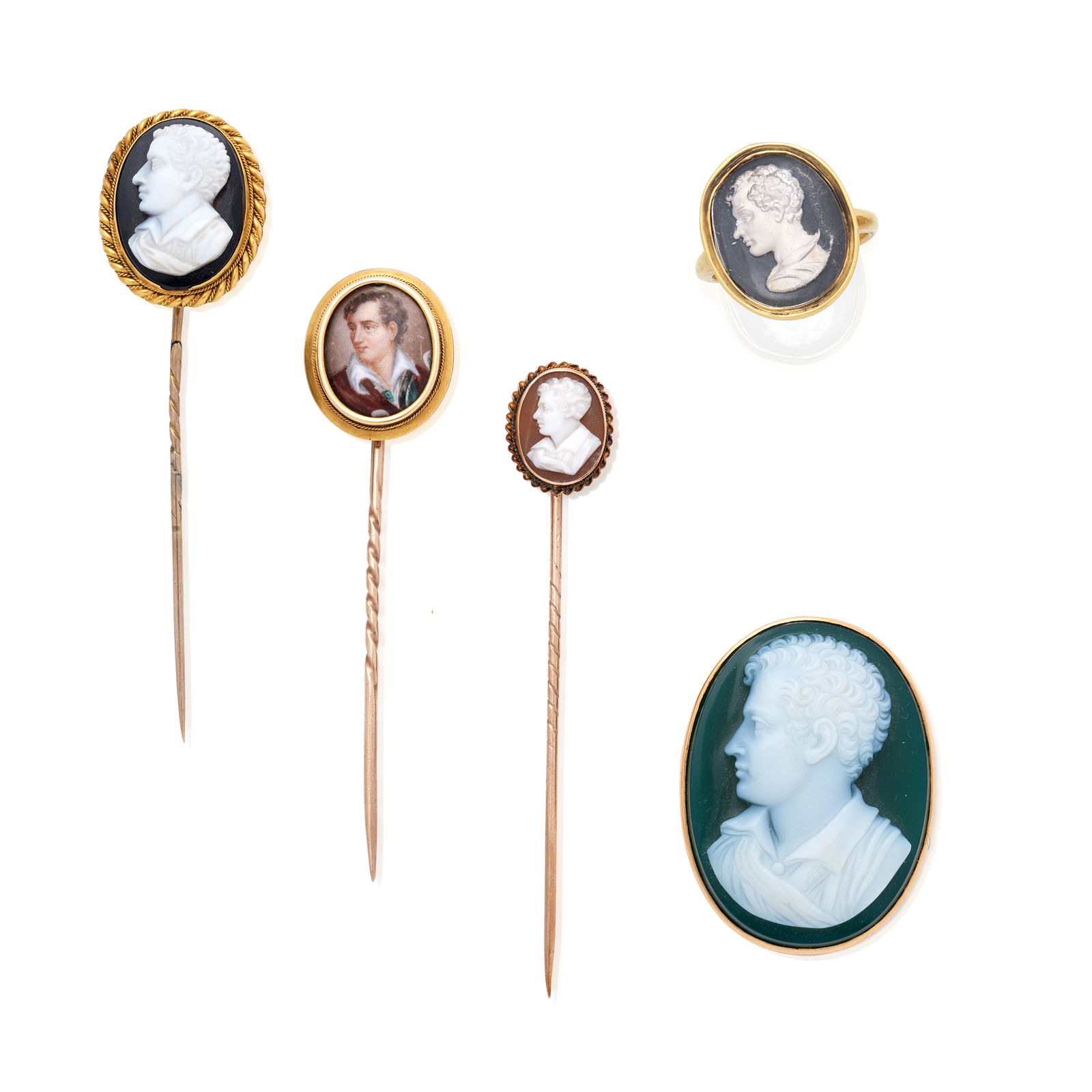 A COLLECTION OF FIVE 19TH CENTURY JEWELS COMMEMORATING LORD BYRON (5): A COLLECTION OF FIVE 19TH CENTURY JEWELS COMMEMORATING LORD BYRON Comprising a ring set with a reverse carved paste intaglio in a closed-back setting, an agate cameo brooch and three stickpins set wit