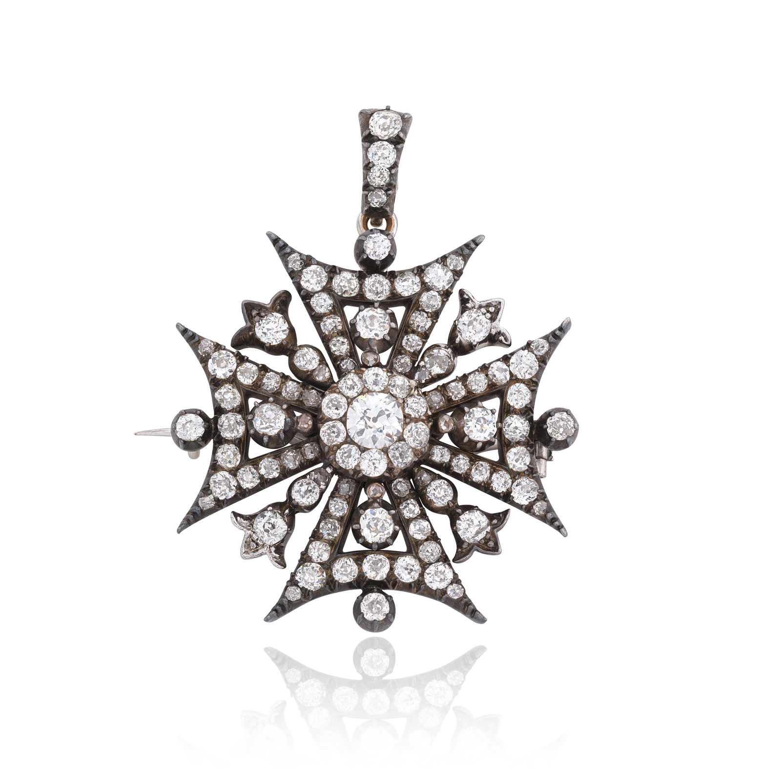 DIAMOND MALTESE CROSS PENDANT/BROOCH, CIRCA 1880: DIAMOND MALTESE CROSS PENDANT/BROOCH, CIRCA 1880Of openwork design, centred by an old cushion-shaped diamond cluster, further set throughout with old cushion and rose-cut diamonds, mounted in silver