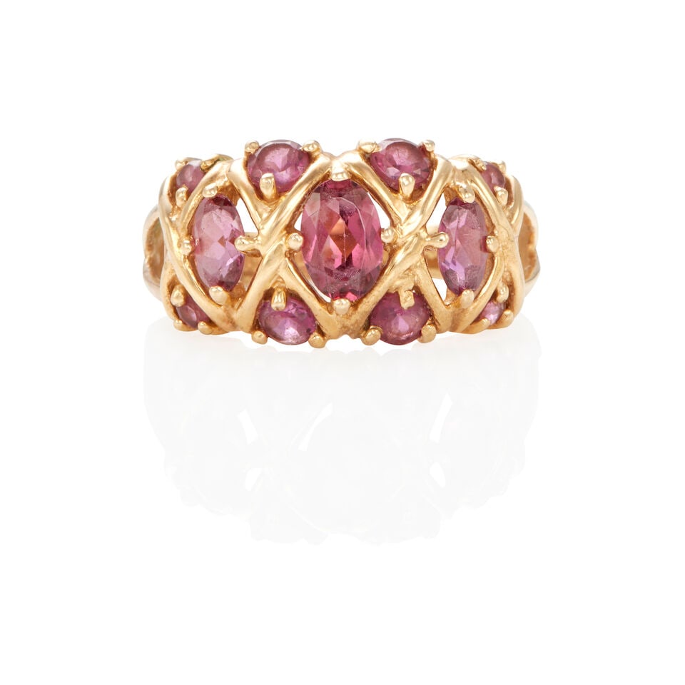 14K GOLD AND PINKISH PURPLE SAPPHIRE RING: 14K GOLD AND PINKISH PURPLE SAPPHIRE RING • 14k yellow gold • Numerous rounds and oval pinkish-Purple sapphires weighing approximately 2.10 - 2.30 carats total • Maker's mark