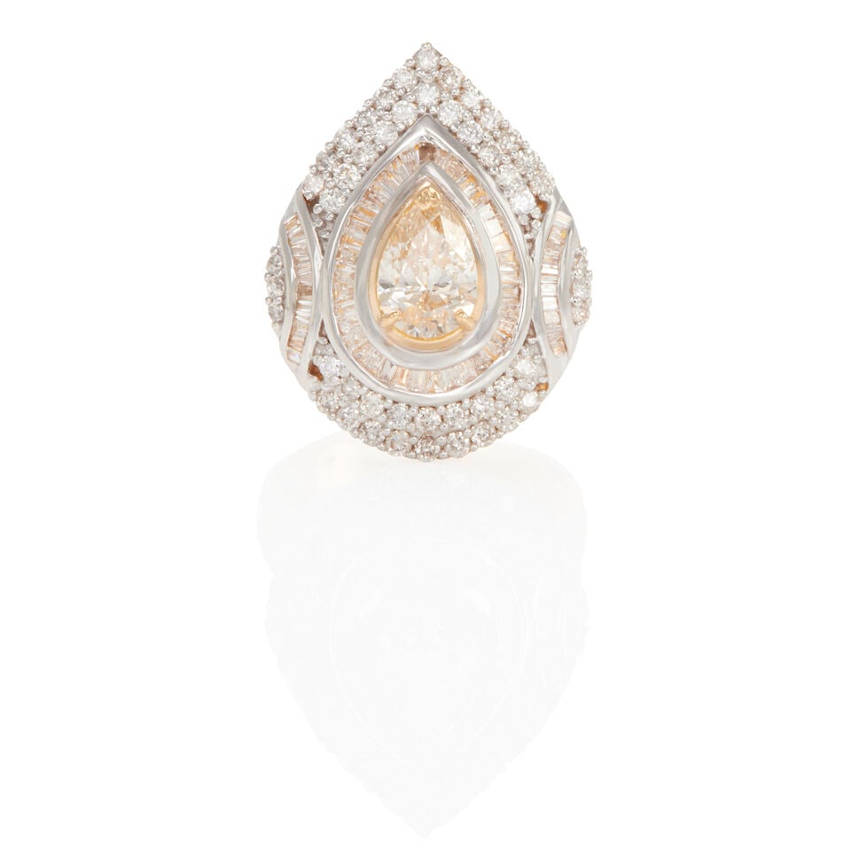 18K BICOLOR GOLD AND DIAMOND RING: 18K BICOLOR GOLD AND DIAMOND RING • 18k white and gold • Numerous round and baguette diamonds weighing approximately 1.05 - 1.15 carat total • 1 pear-shaped center diamond weighing
