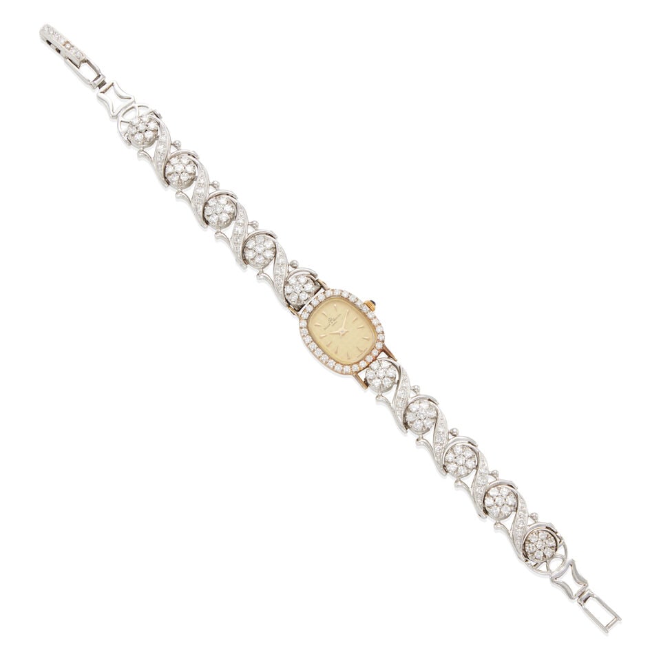 BAUME ET MERCIER: 14K GOLD AND DIAMOND WRISTWATCH: BAUME ET MERCIER: 14K GOLD AND DIAMOND WRISTWATCH • 14k white gold with yellow gold case • 125 round and round single diamonds weighing approximately 2.75 -2.85 carats total •