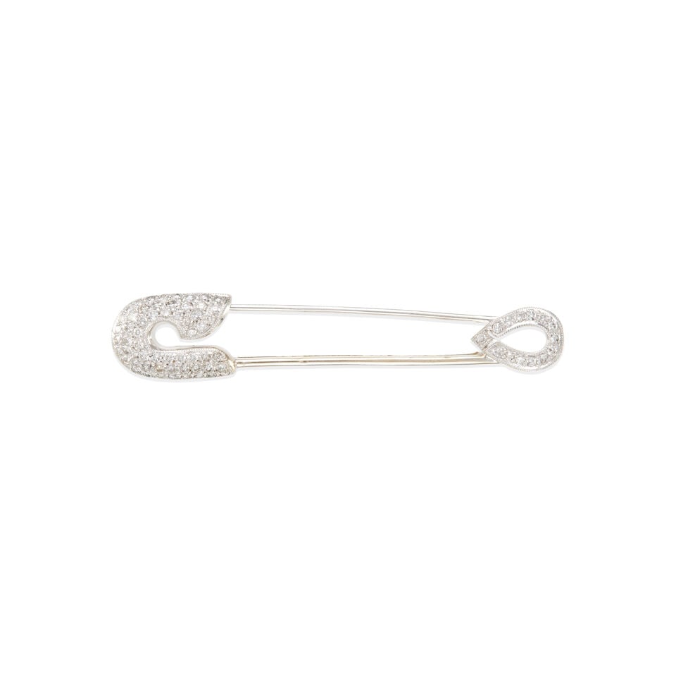 18k GOLD AND DIAMOND SAFETY PIN: 18k GOLD AND DIAMOND SAFETY PIN • 18k white gold • Numerous round diamonds weighing approximately 0.35 - 0.45 carats total • Measures 2 1/8 x 7/16 in. • Estimated gross weight: