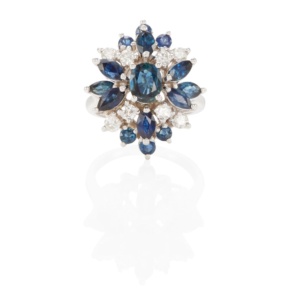 14K GOLD, DIAMOND AND SAPPHIRE RING: 14K GOLD, DIAMOND AND SAPPHIRE RING • 14k white gold • 8 round diamonds weighing approximately 0.35 - 0.45 carat total • 15 oval, round and marquise sapphires weighing approximately