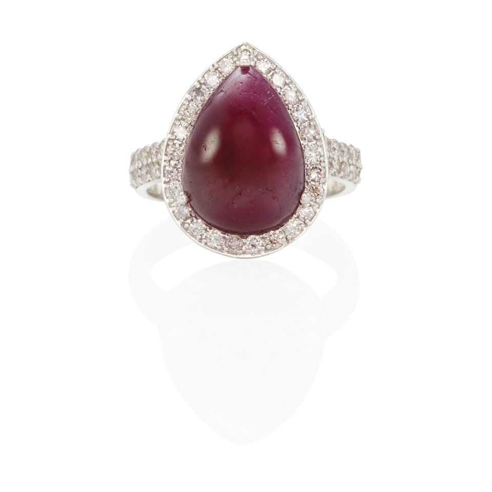 18K GOLD, RUBY AND DIAMOND RING WITH GIA REPORT: 18K GOLD, RUBY AND DIAMOND RING WITH GIA REPORT • 18k white gold • Numerous round diamonds weighing approximately 0.75 - 0.85 carat total • 1 pear-shaped ruby measuring