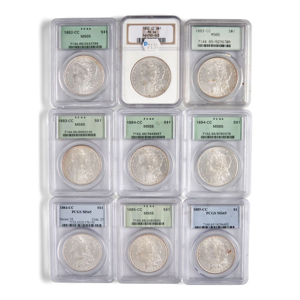 NINE UNITED STATES CARSON CITY MORGAN DOLLARS.: NINE UNITED STATES CARSON CITY MORGAN DOLLARS. Including: one 1882-CC, graded NGC MS66; one 1882-CC, graded PCGS MS65; two 1883-CC, graded PCGS MS65; three 1884-CC, graded PCGS MS65; and two 1885-CC,