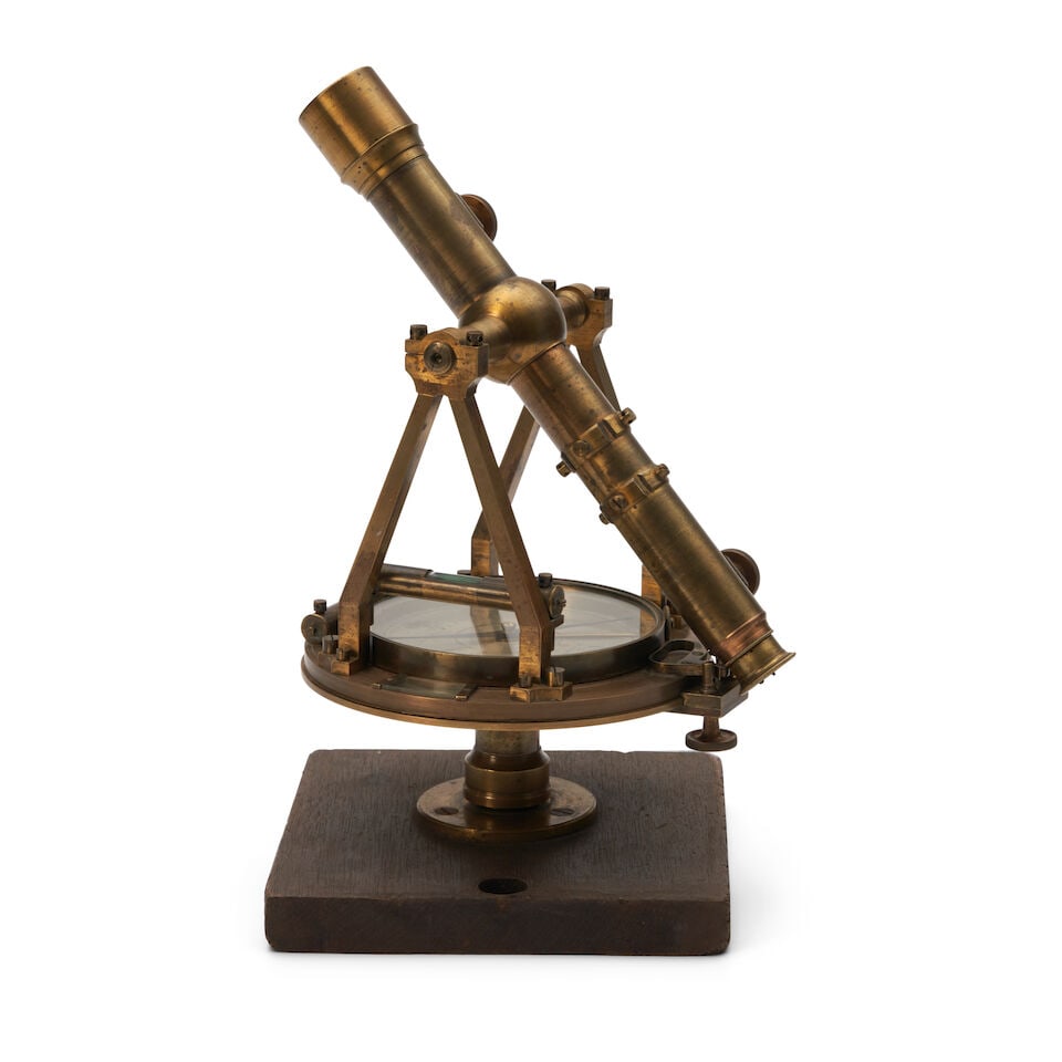 An American Brass Theodolite by James Foster, Jr. & Co., Cincinnati, Ohio, mid-19th century,: An American Brass Theodolite by James Foster, Jr. & Co., Cincinnati, Ohio, mid-19th century, the brass instrument with rotating compass plate, sighting telescope, and adjustable supports, mounted to