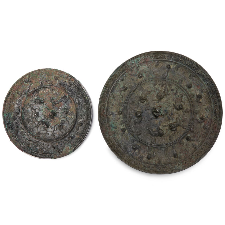 Two Silvered Bronze 'Lion and Grapevine' Mirrors China, Tang style, (2) (1 of 2)
