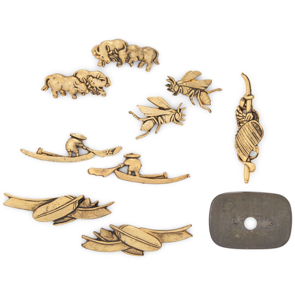 Nine Mixed-Metal Menuki and a Kanamono Japan, (9): Nine Mixed-Metal Menuki and a Kanamono Japan, Four pairs of menuki; and a kanamono with armor shoulder pad motif. 2in (5cm) width of widest (9). Lot to be sold without reserve. This lot is subject to 