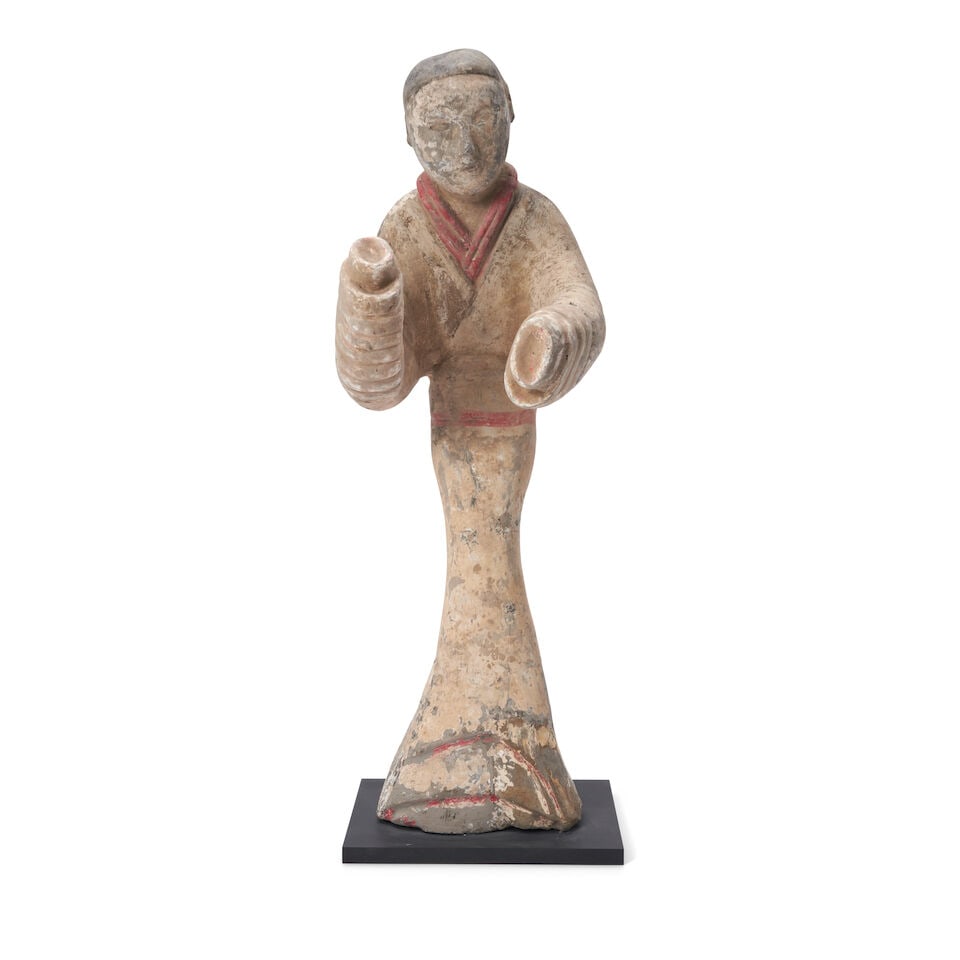 A Painted Pottery Figure of a Dancer China, Han dynasty,: A Painted Pottery Figure of a Dancer China, Han dynasty, 21in (53.3cm) high, wood base Lot to be sold without reserve. This lot is subject to the following lot symbols: ¤ ¤ Unless indicated 