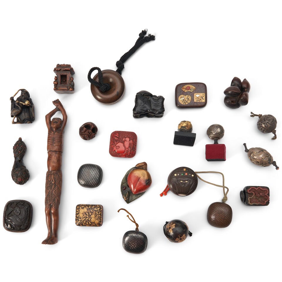 Twenty-three Wood and Metal Netsuke and Accessories Japan, (23): Twenty-three Wood and Metal Netsuke and Accessories Japan, A gilt-metal netsuke of Fukurokuju; a wood carving of a shrine; a carved wood manju compass; a wood carving of a mountain with a hidden inter