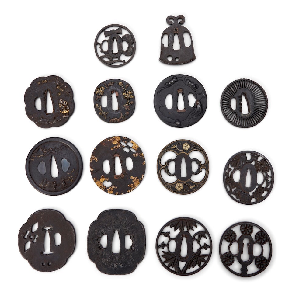 Fourteen Iron Tsuba Japan, Edo period (1615-1868) or Meiji era (1868-1912), (14): Fourteen Iron Tsuba Japan, Edo period (1615-1868) or Meiji era (1868-1912), Some with openwork, some with gilt decorations, six signed. 3 1/8in (7.9cm) diam of largest (14). Lot to be sold without res