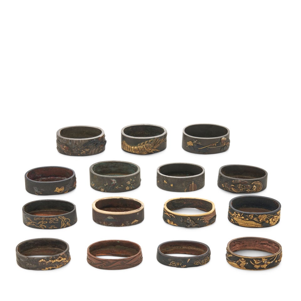 Fifteen Mixed-metal Fuchi Japan, late Edo period (1615-1868) or Meiji era (1868-1912), (15): Fifteen Mixed-metal Fuchi Japan, late Edo period (1615-1868) or Meiji era (1868-1912), One iron; six shakudo, two signed; four shakudo nanako, one signed; three shibuichi, all signed; and one copper. 