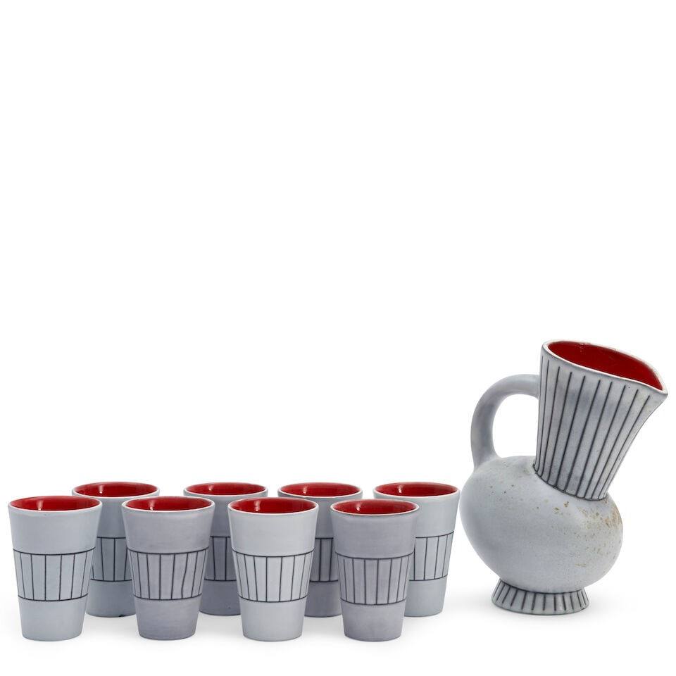 Andre Baud (1903-1986) Pitcher And Eight Cups, Vallauris, France, c. 1950, glazed ceramic, foot ...: Andre Baud (1903-1986) Pitcher And Eight Cups, Vallauris, France, c. 1950, glazed ceramic, foot rim of pitcher impressed 'André Baud' and 'Vallauris,' foot rims of cups impressed 'Vallauris,'