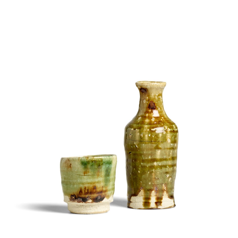 KOIE RYŌJI 鯉江良二 (1938-2020) An Oribe-Style Tokkuri (Sake Bottle...: KOIE RYŌJI 鯉江良二 (1938-2020) An Oribe-Style Tokkuri (Sake Bottle) and Guinomi (Sake Cup) Heisei era (1989-2019), 2006 and 2011 Both of jaunty, slightly irregular form,
