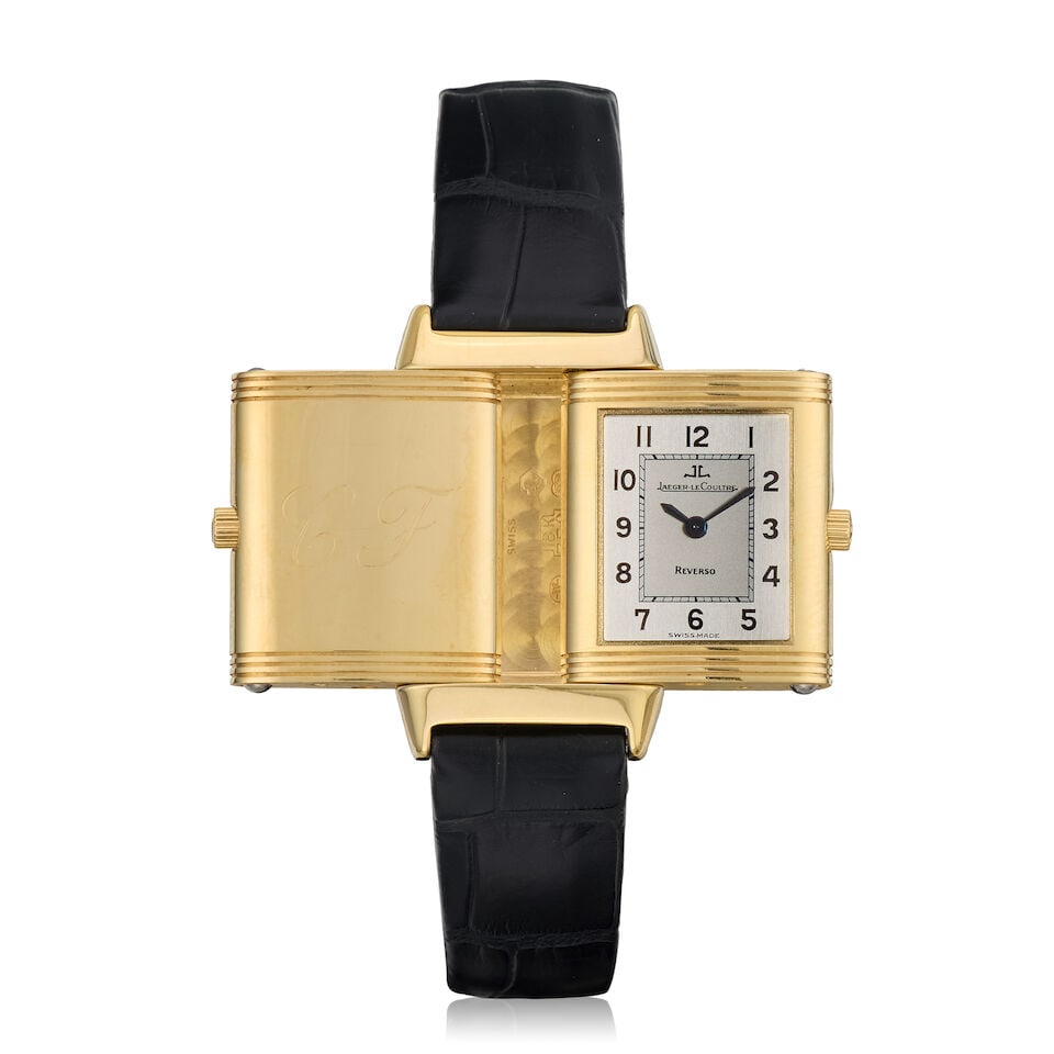 Jaeger-LeCoultre. A lady's 18K gold quartz reversible wristwatch Reverso Lady, Ref: 260.1.08, P...: Jaeger-LeCoultre. A lady's 18K gold quartz reversible wristwatch Model: Reverso Lady Reference: 260.1.08 Date: Purchased 24th December 1999 Movement: 7-jewel quartz, No.2841619 Dial: Silvered Case: Br